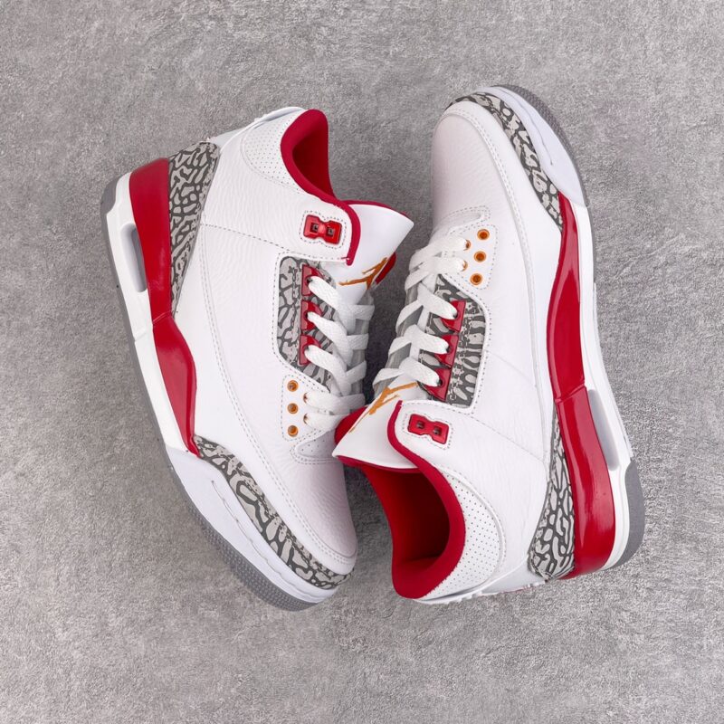 White and red high-top sneakers with white laces and gray patterned decorations