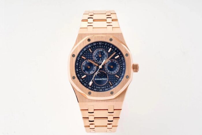 Rose gold watch with a blue dial and matching bracelet.